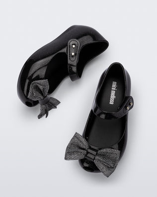 Top and side view of a pair of black glitter Ultragirl Sweet baby ballerina flats