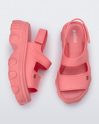 Top and side view of a pair of pink Ella Move platform sandals.