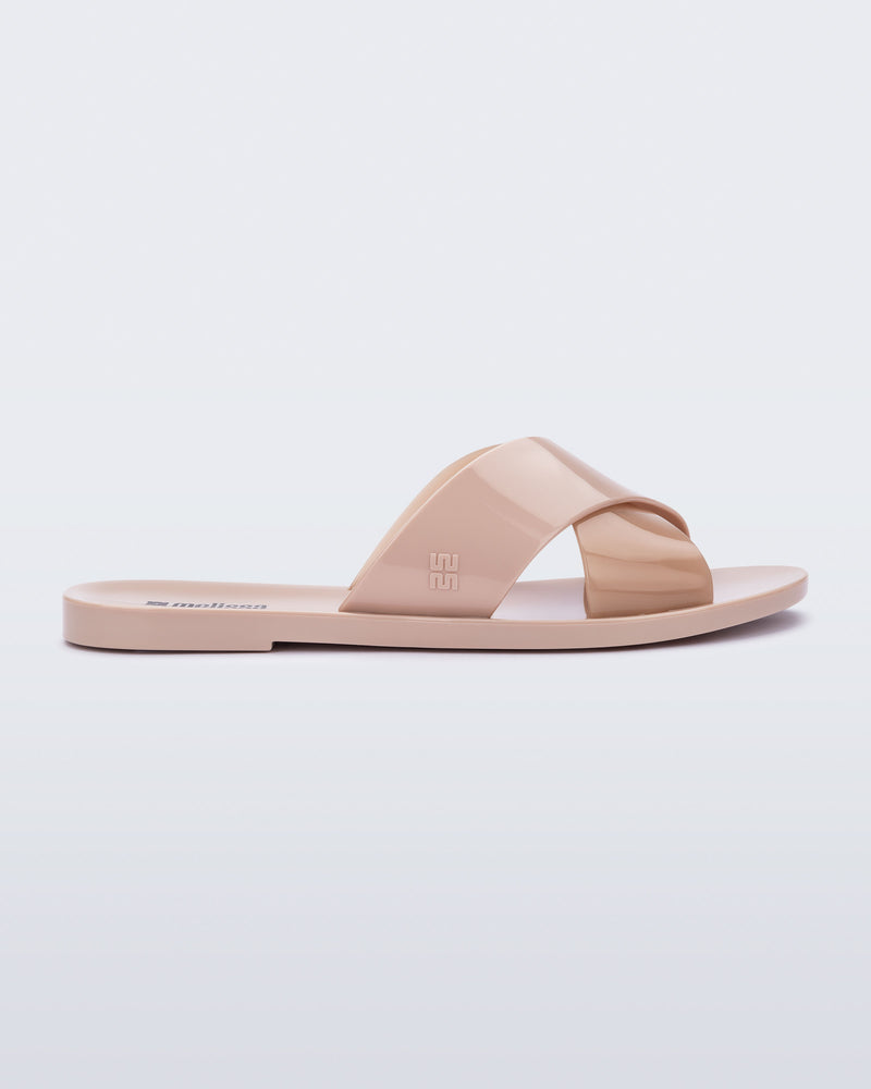 Side view of a pink Essential Cross Slide sandal