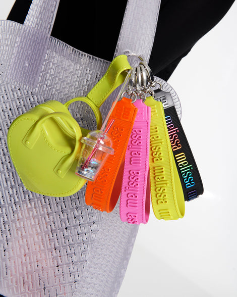 View of the green Heartbeat Pocket bag charm on the Harper bag along with the Drink Charm and M Lover charm