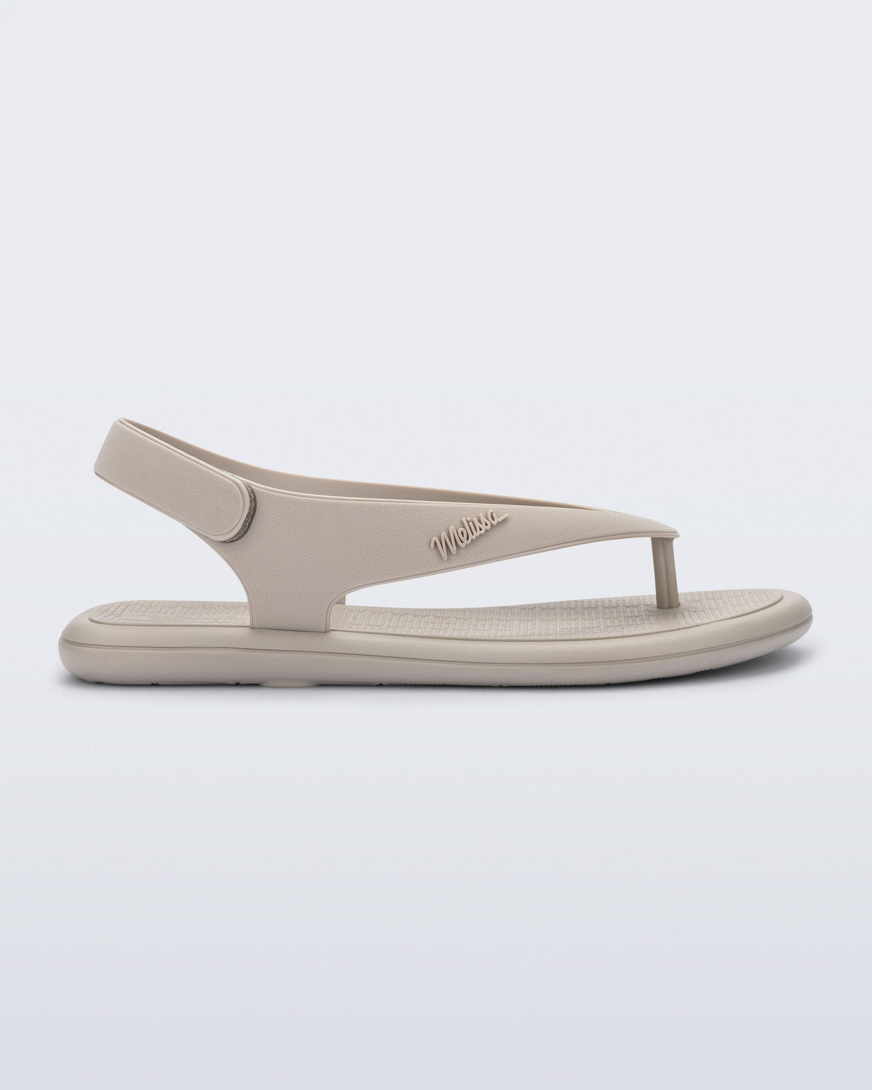 Side view of a beige Sun Samba thong sandal