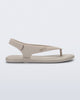 Side view of a beige Sun Samba thong sandal