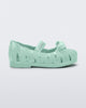 Side view of a glitter green M Lover Ballerina baby flat with bow and strap