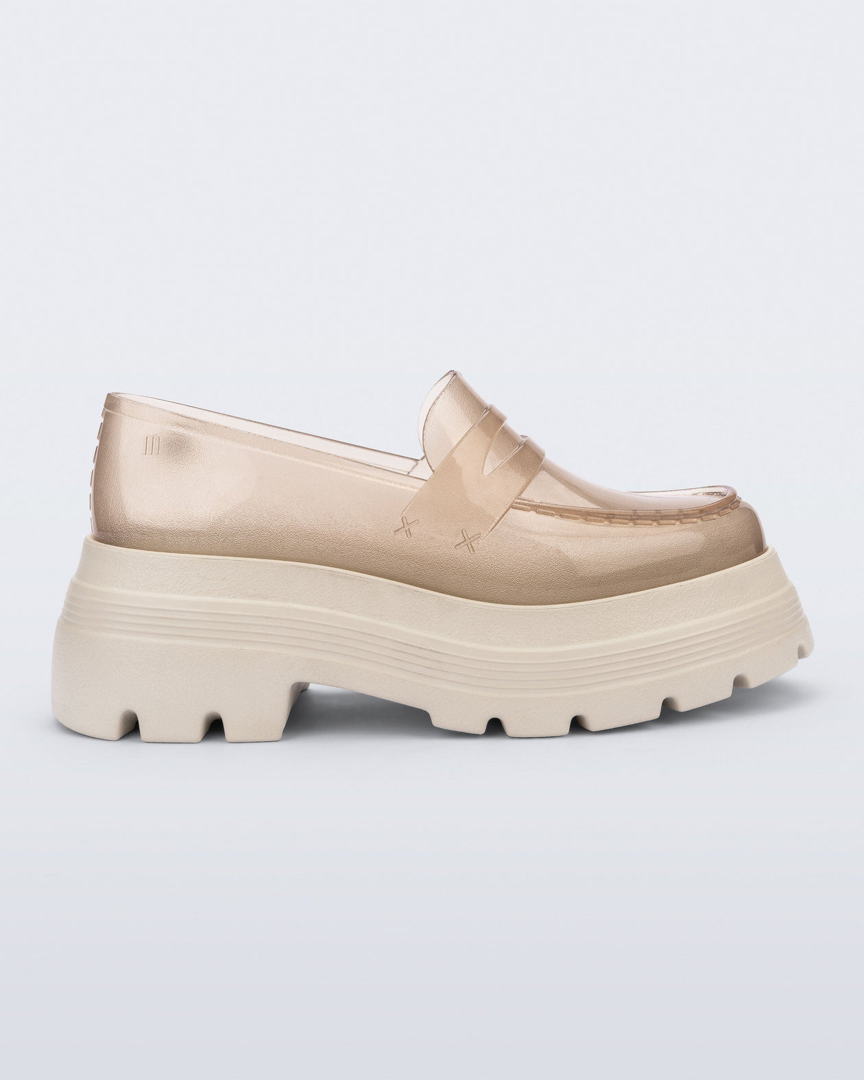 Side view of a transparent beige Royal High + Undercover platform loafer with beige sole. 