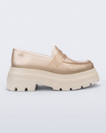 Side view of a transparent beige Royal High + Undercover platform loafer with beige sole. 