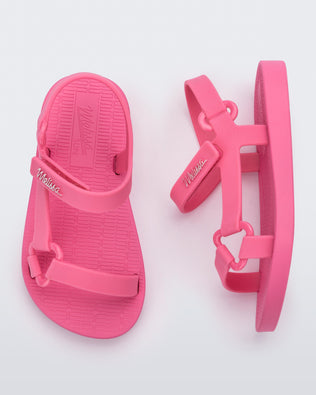 Top and side view of a pair of pink Sun Downtown baby sandals