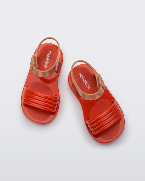 Top view of a pair of red Mar Wave baby sandals with beige strap.