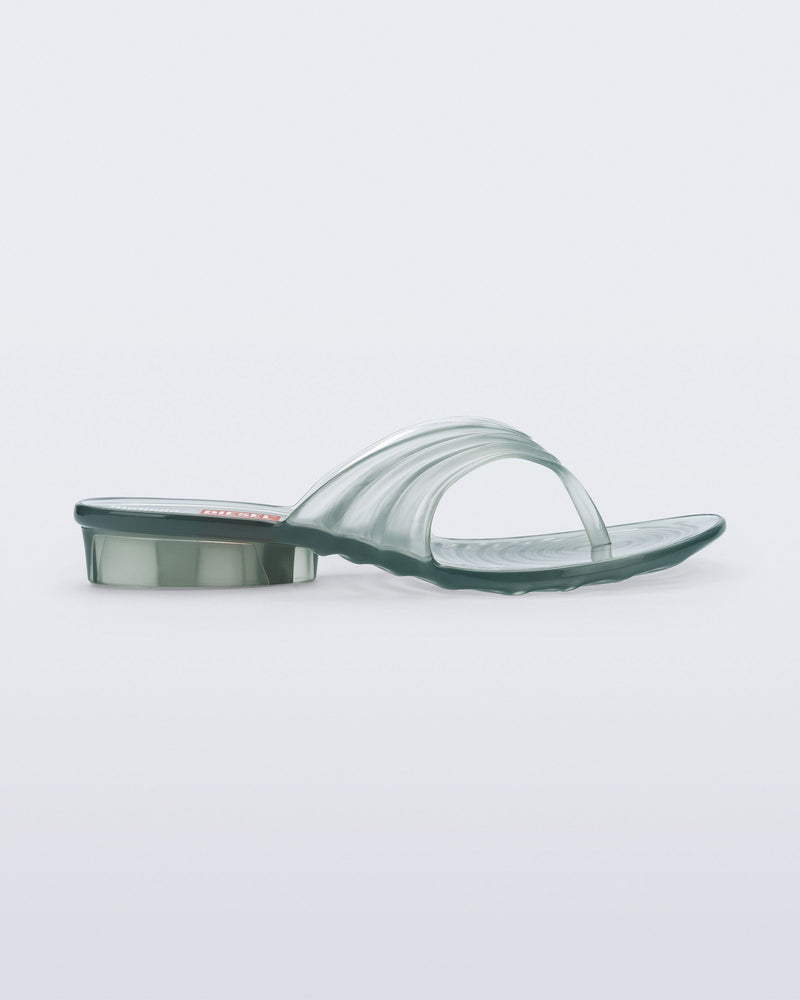 Side view of a transparent green Flip Flop + Diesel sandals