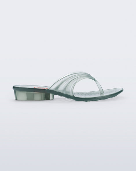 Side view of a transparent green Flip Flop + Diesel sandals