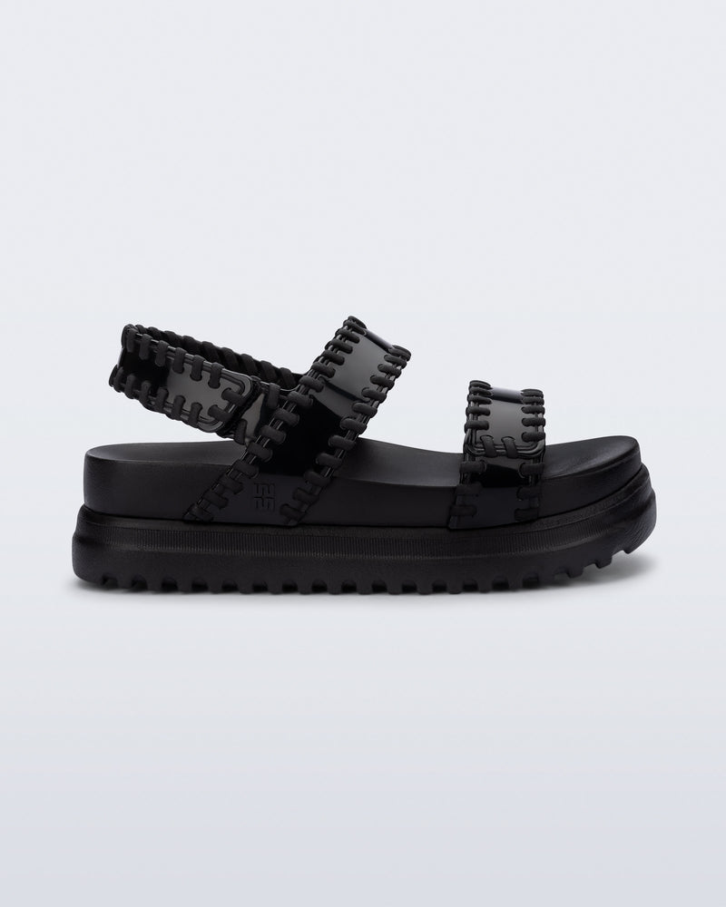 Side view of a black Dune Platform Sandal with faux stitching on the straps