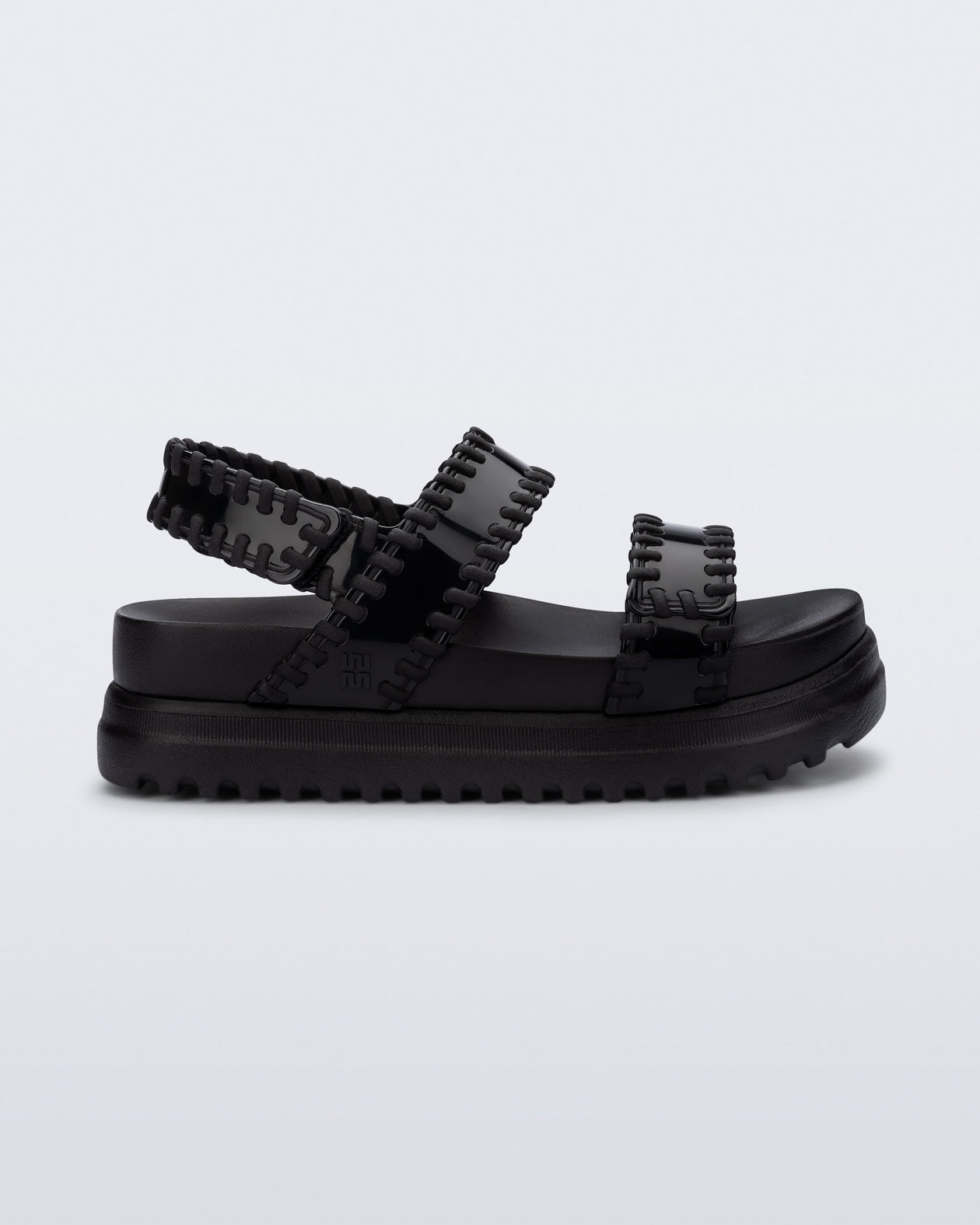 Side view of a black Dune Platform Sandal with faux stitching on the straps
