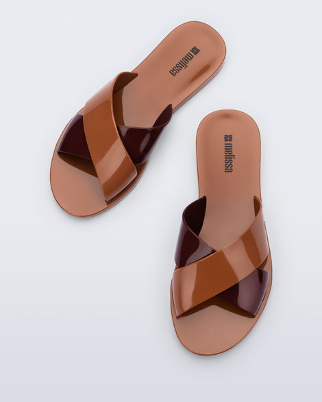 Top view of a pair of brown Essential Cross Slide sandals