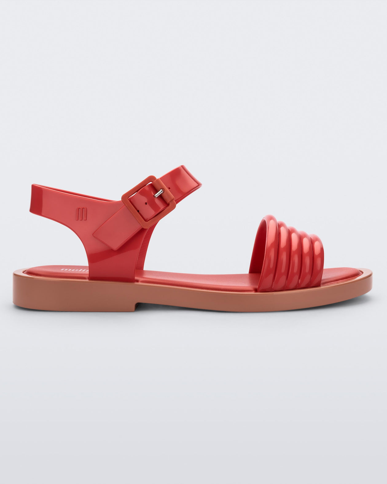 Side view of a red Mar Wave women's sandal with beige sole.