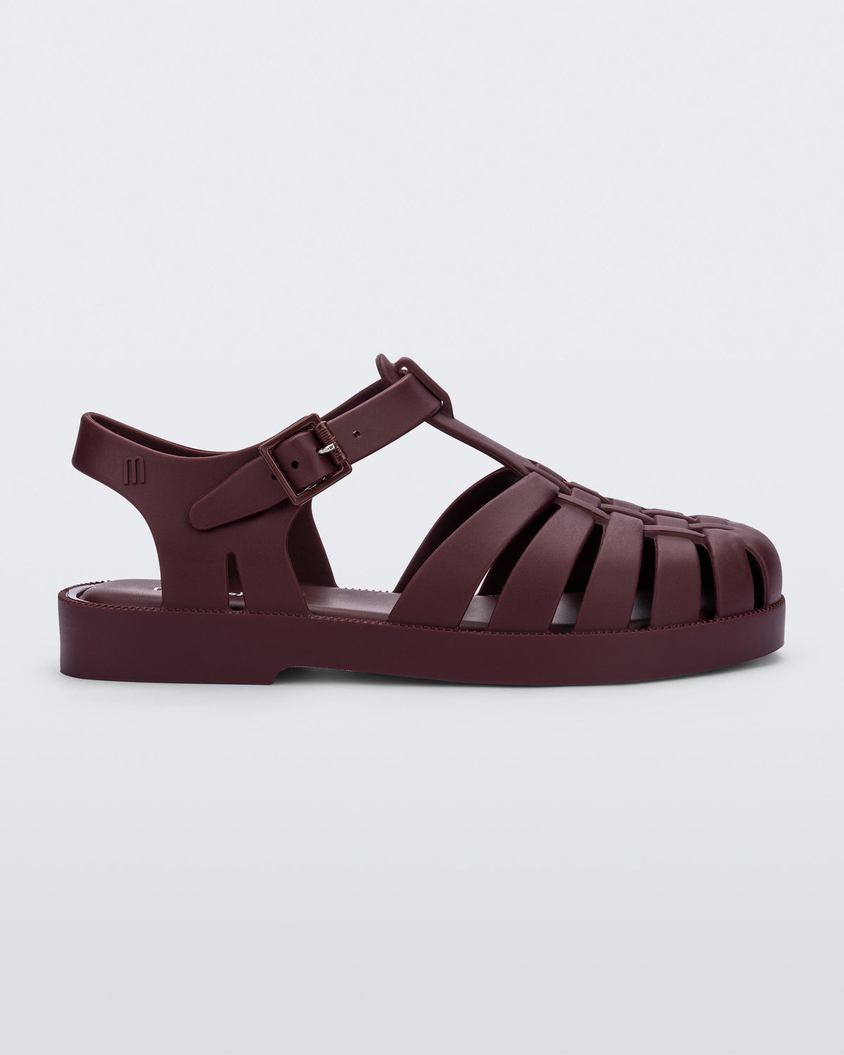 Side view of a matte burgundy Possession kids fisherman sandal.