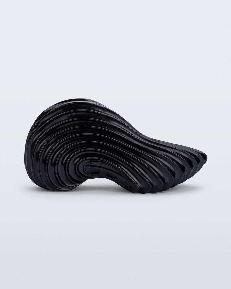Side view of a black Sneaker + Diesel