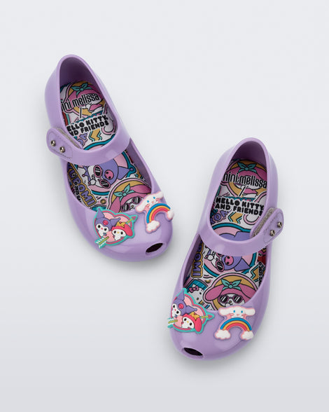 Top view of a pair of lilac Ultragirl + Hello Kitty and Friends baby flats with Hello Kitty Friends on the upper