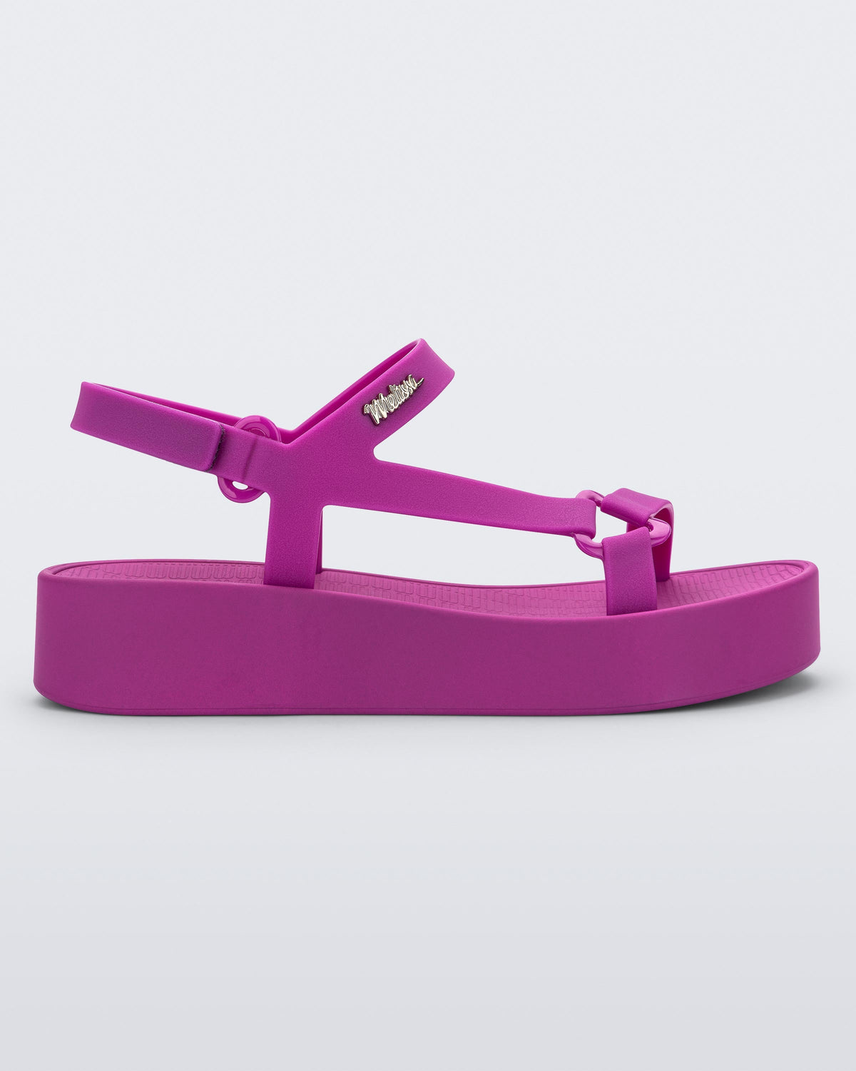 Side view of a dark pink Sun Downtown Platform sandal.