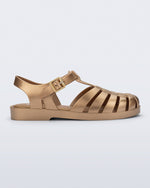 Side view of a gold Possession fisherman sandal