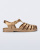 Side view of a gold Possession fisherman sandal