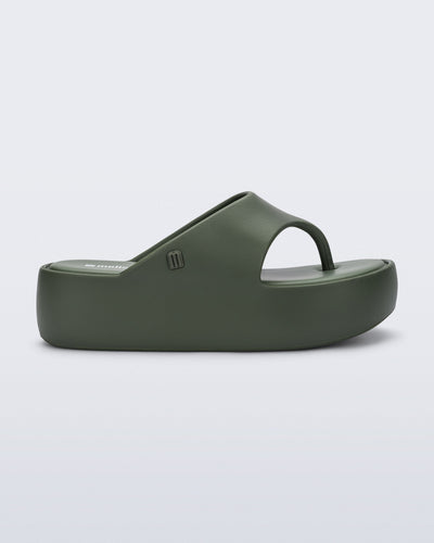 Side view of a green Free Platform Thong flip flop