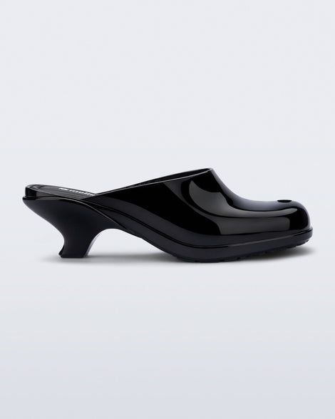 Side view of a black Gaia kitten heel with peep toe