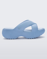 Side view of a blue Free Rise platform slide sandal