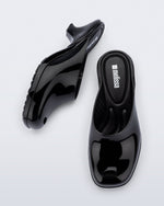 Top and side view of a pair of black Gaia kitten heels with peep toe