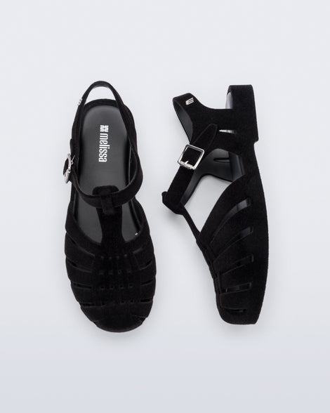 Side and top view of a pair of flocked black Possession Velvet fisherman sandals