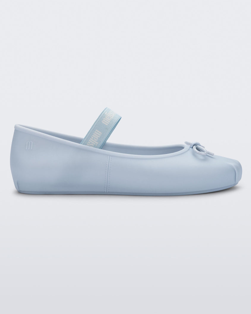 Side view of a Melissa Sophie ballet flat in blue with M-logo strap and bow applique