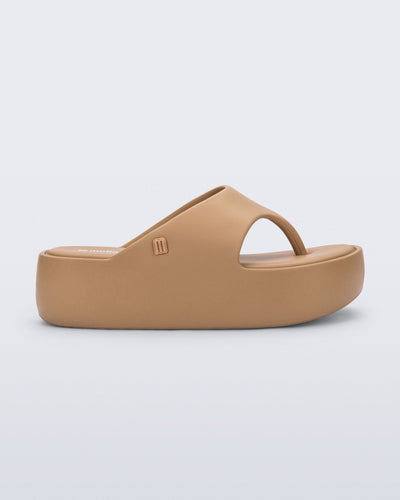 Side view of a green Free Platform Thong flip flop