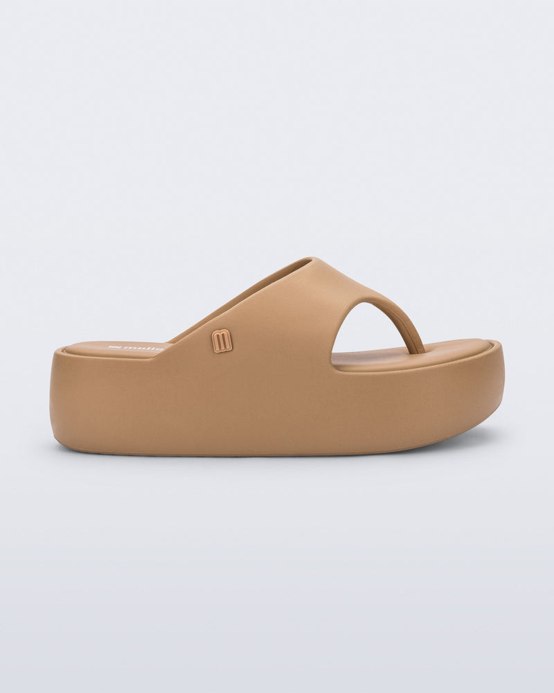 Side view of a green Free Platform Thong flip flop