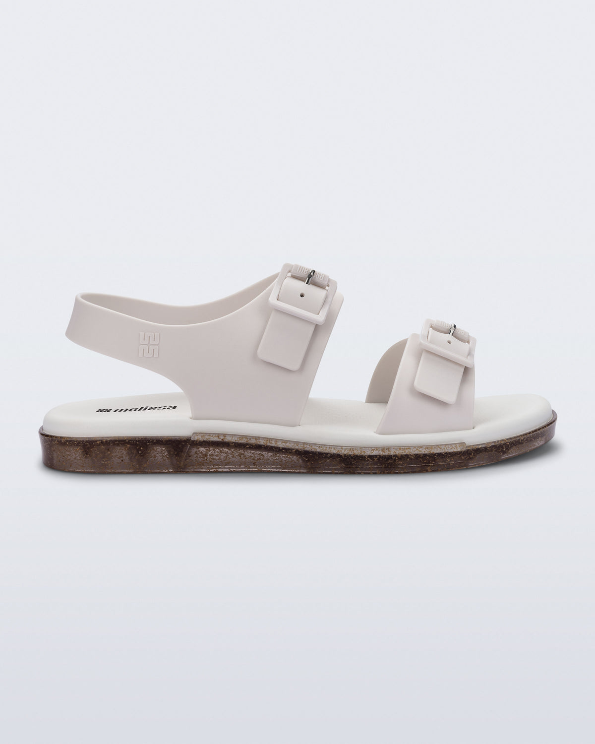 Side  view of a beige Wave Sandal with two straps with buckles and a back strap