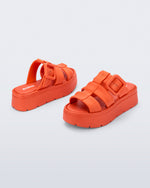 Back and angled view of a pair of orange  Pump Platform sandals