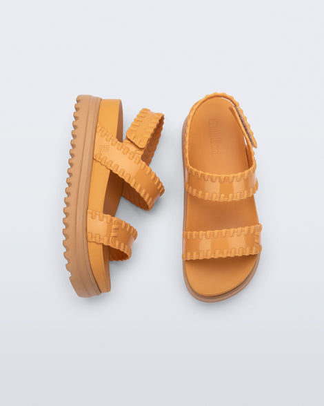Top and side view of a pair of orange Dune Platform Sandals with faux stitching on the straps and beige sole.