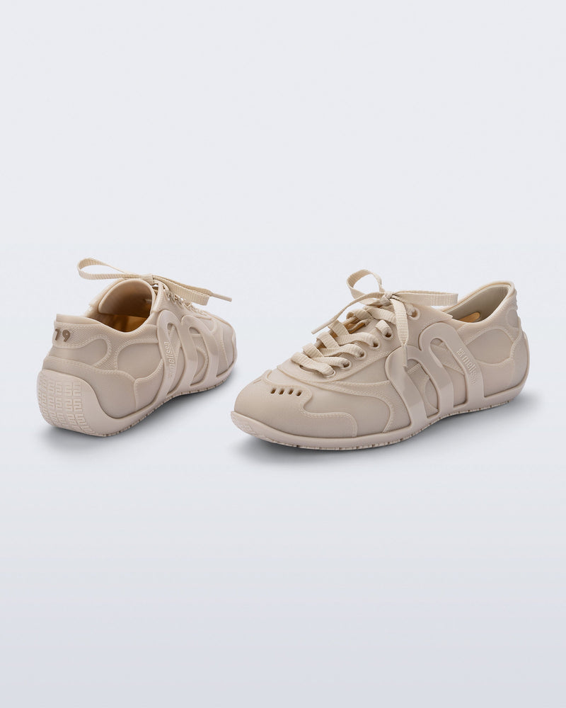 Back and Side view of a pair of beige Motion Sneakers