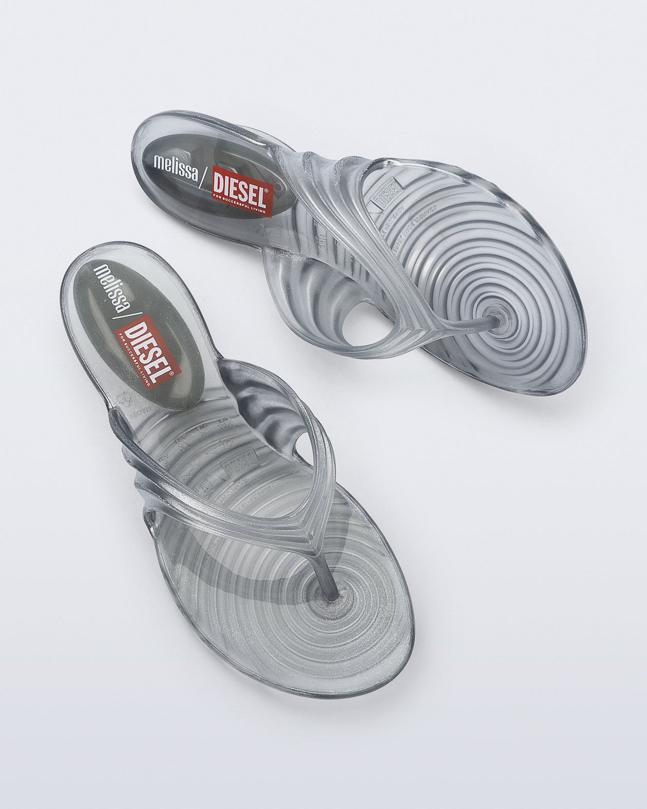 Side and top view of a pair of Silver Quantum Flip Flops