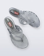 Side and top view of a pair of Silver Quantum Flip Flops