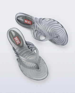 Side and top view of a pair of Silver Quantum Flip Flops
