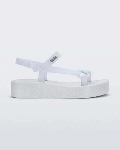 Side view of a white glitter Sun Downtown Platform sandal