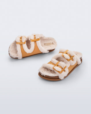 Top and angled view of a pair of orange Cozy Warm Slides with beige fuzzy insoles