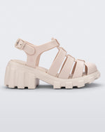 Side view of a beige Megan kids heel sandal.