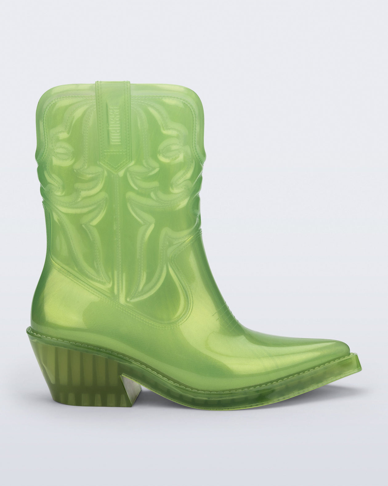 Side view of a pearly green Texas boot with pointed toe.