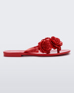 Side view of a red Harmonic Springtime women's flip flop with 3 red flowers.