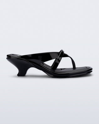 Side view of a black Layla kitten heel flip flop