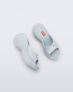 Top and side view of a pair of light blue Platforms + Diesel slides