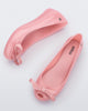 Top and side view of a pair of pink Ultragirl Bow flats