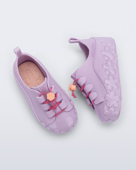 Top and side view of a pair of purple Bloomy Sneaker with pink laces and flower details on the sole