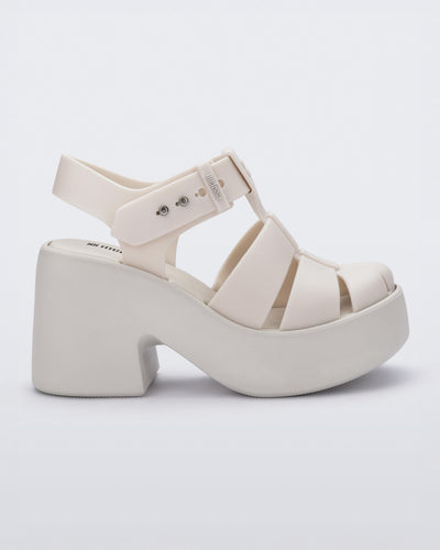 Side view of a matte beige Lulu platform heel sandal