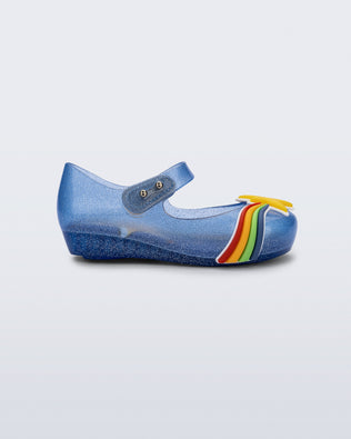 Side view of a glitter blue Ultragirl Colors baby flat with yellow star and rainbow on top
