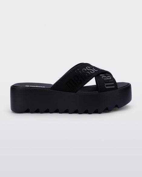 Side view of a black M Lover Cross Strap platform slide